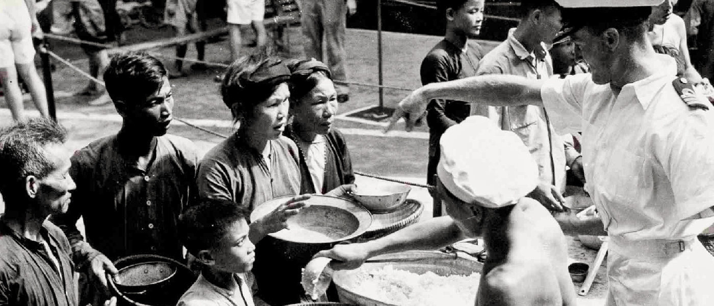 Vietnamese refugees aboard HMS Warrior after an evacuation by the Royal Navy, 1954; Crown Copyright images reproduced courtesy of The National Archives, UK.!''