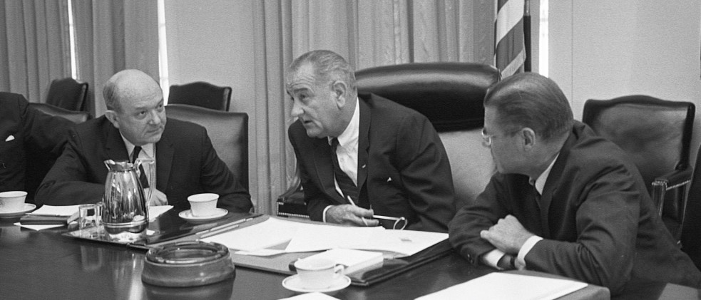 Secretary of Defense Robert McNamara (right), President Lyndon Baines Johnson, and Secretary of State Dean Rusk, seated at a table after McNamara’s return from South Vietnam, 1965 | Library of Congress